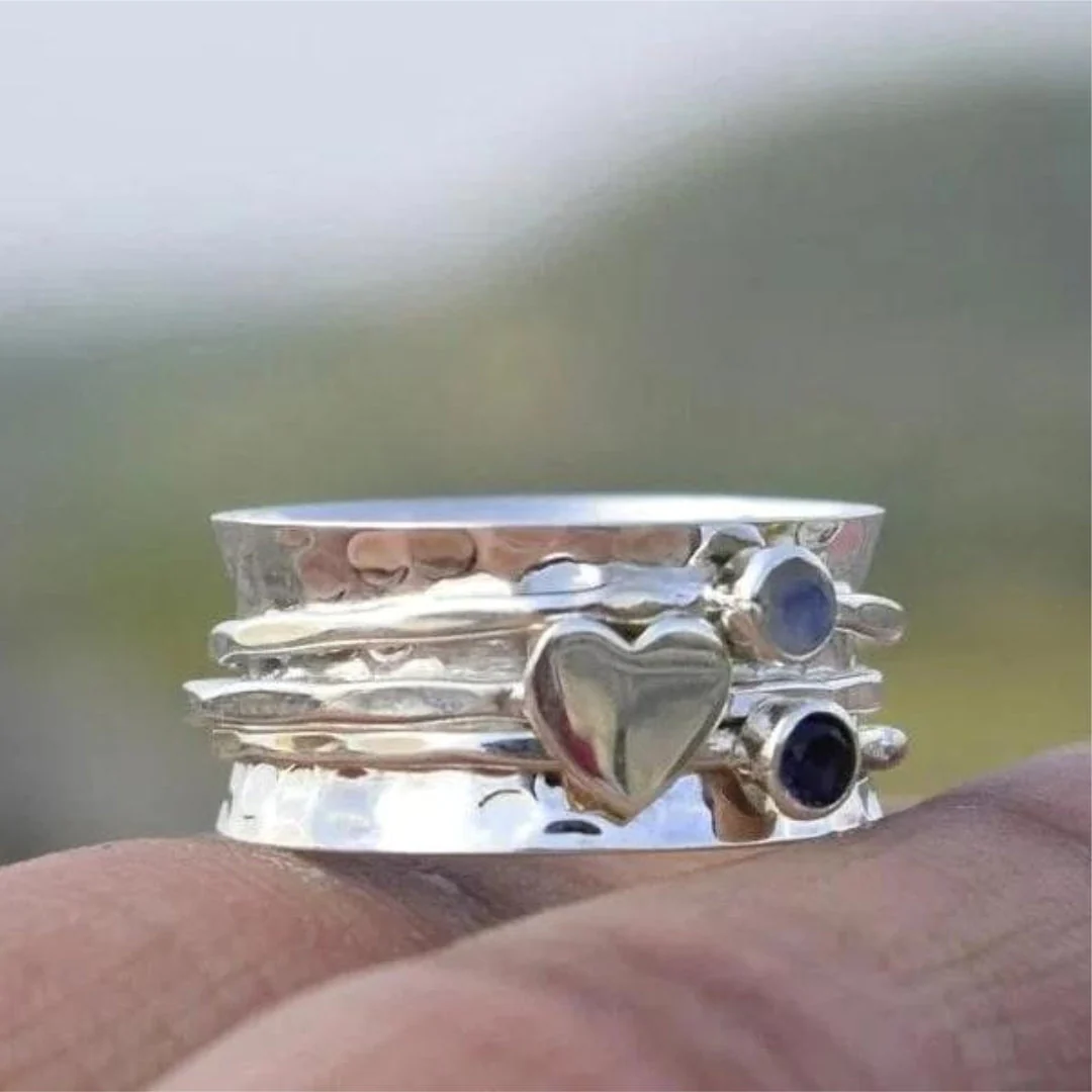 Elegant Rotating Heart Silver Ring